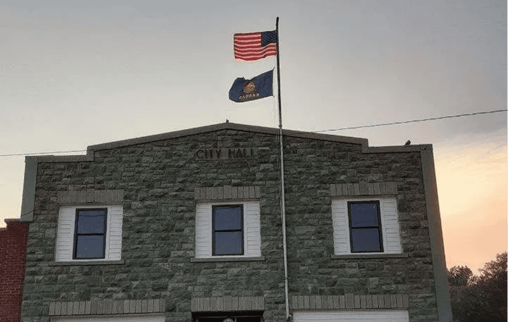 Flags flying above city hall building