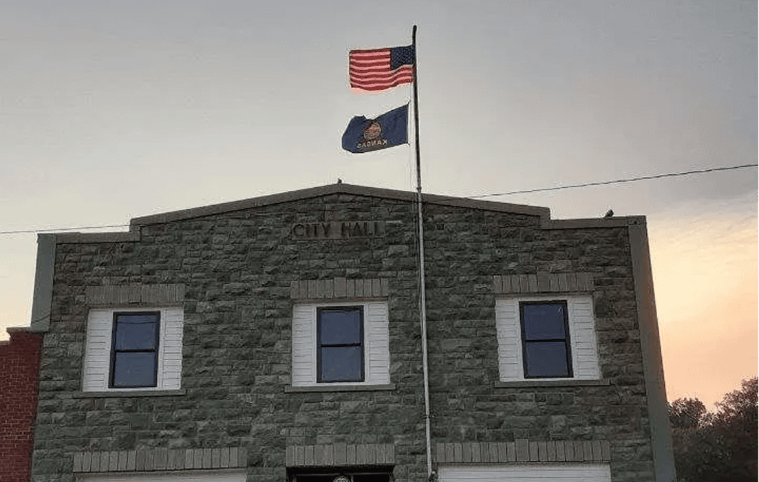 Flags flying above city hall building