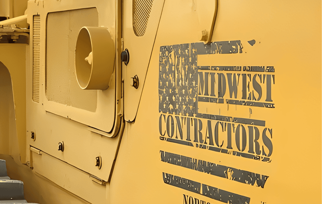 Heavy machinery with Midwest Contractors logo